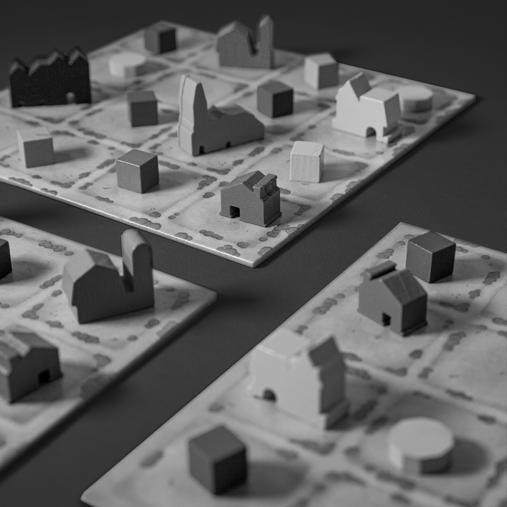 Black and white close-up image of Tiny Towns components on game boards